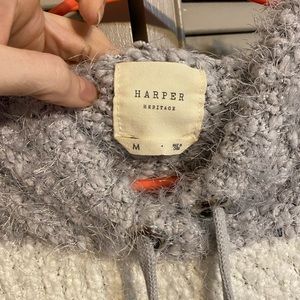 Gray and white striped sweater with poms and hood